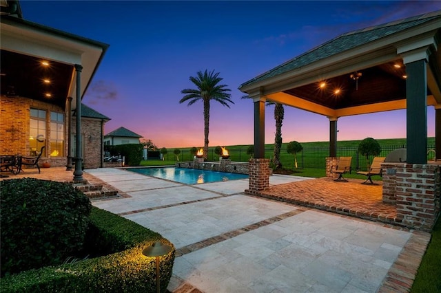 24 Royal Palm Dr, Kenner, LA 70065 - pool at dusk with a patio, an outdoor pool, and a gazebo