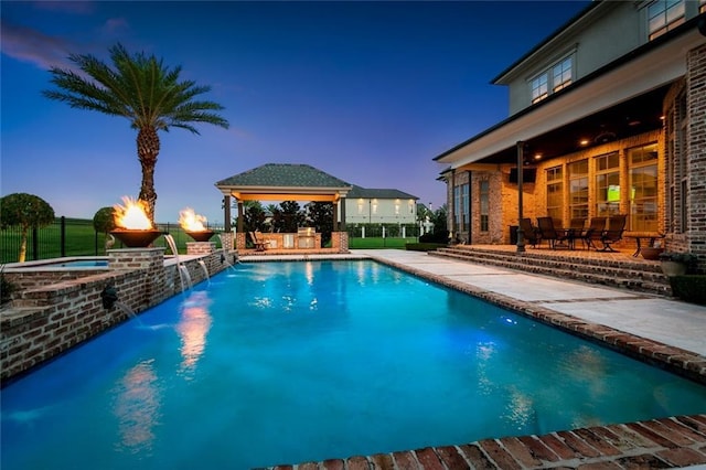 24 Royal Palm Dr, Kenner, LA 70065 - view of swimming pool featuring a gazebo, a patio area, and a pool with connected hot tub