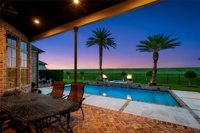 24 Royal Palm Dr, Kenner, LA 70065 - pool at dusk with a patio area, an in-ground hot tub, and a fenced backyard