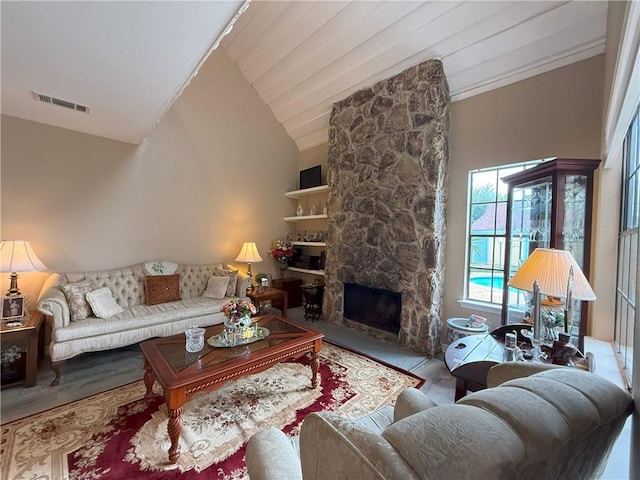 4135 Loire Dr Unit B, Kenner, LA 70065 - living room with vaulted ceiling, a stone fireplace, and wood finished floors