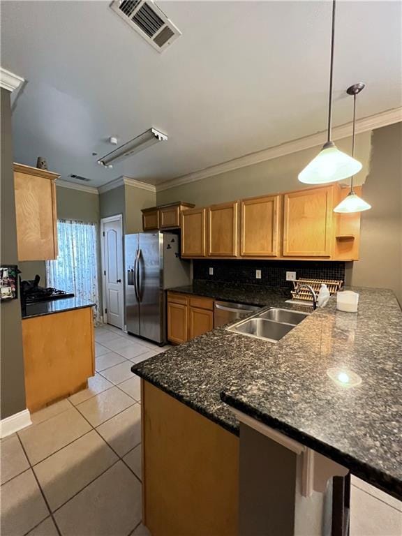 146 Emerald Oaks Dr, Covington, LA 70433 - kitchen with stainless steel appliances, crown molding, a peninsula, light tile patterned flooring, and pendant lighting