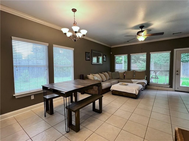 146 Emerald Oaks Dr, Covington, LA 70433 - dining space featuring light tile patterned floors, a chandelier, crown molding, and a ceiling fan