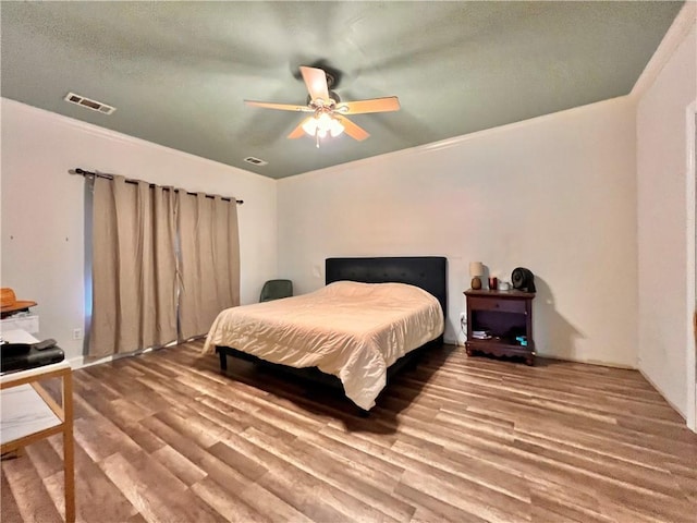 146 Emerald Oaks Dr, Covington, LA 70433 - bedroom with wood finished floors, ceiling fan, and ornamental molding