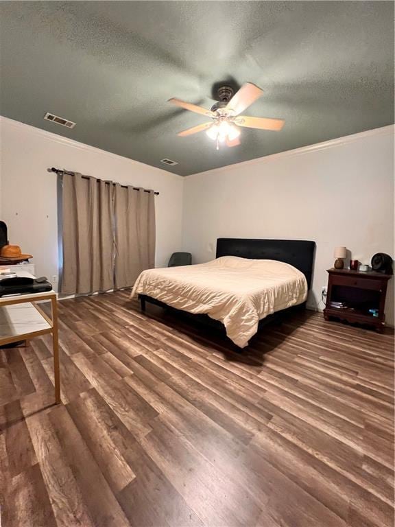 146 Emerald Oaks Dr, Covington, LA 70433 - bedroom featuring wood finished floors, crown molding, a textured ceiling, and a ceiling fan