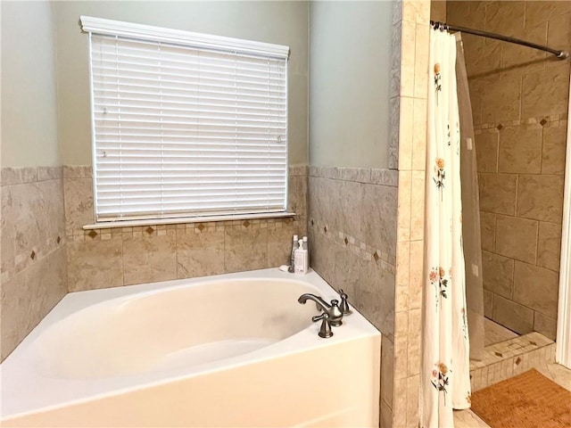 146 Emerald Oaks Dr, Covington, LA 70433 - bathroom with a bath, a shower stall, and tile walls