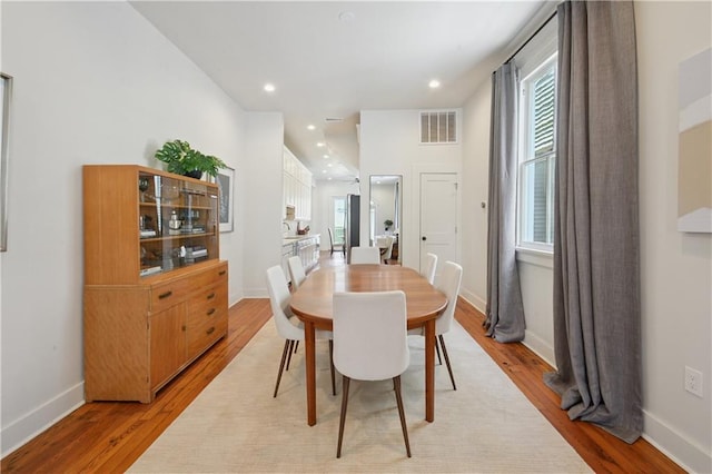20810 S Scott St, New Orleans, LA 70119 - dining space with light wood-style floors, plenty of natural light, and recessed lighting