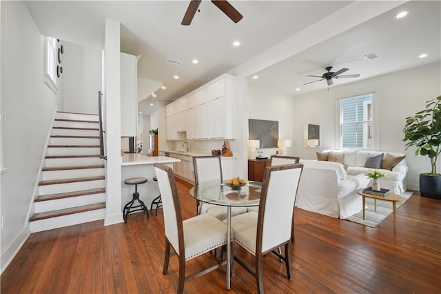 20810 S Scott St, New Orleans, LA 70119 - dining room with a ceiling fan, dark wood-type flooring, stairway, and recessed lighting