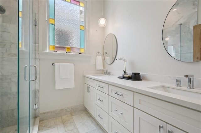 20810 S Scott St, New Orleans, LA 70119 - bathroom featuring a marble finish shower, marble finish flooring, and double vanity