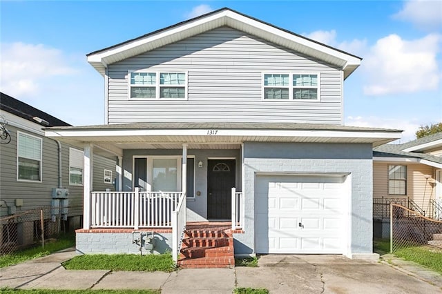 1317 Nunez St, New Orleans, LA 70114 - view of front of property featuring a porch, a garage, driveway, and brick siding