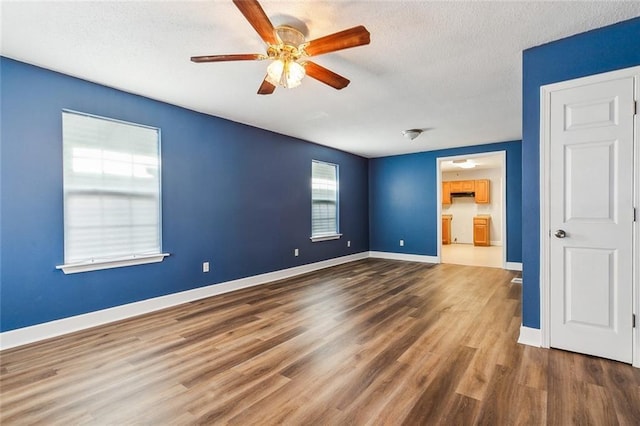 1317 Nunez St, New Orleans, LA 70114 - empty room featuring ceiling fan, wood finished floors, and a textured ceiling
