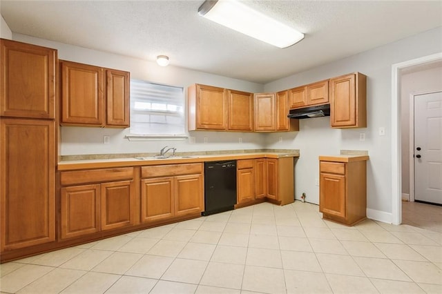 1317 Nunez St, New Orleans, LA 70114 - kitchen featuring black dishwasher, under cabinet range hood, brown cabinets, and a textured ceiling
