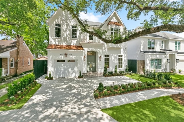 108 Dorrington Blvd, Metairie, LA 70005 - view of front of house with an attached garage, stucco siding, and driveway