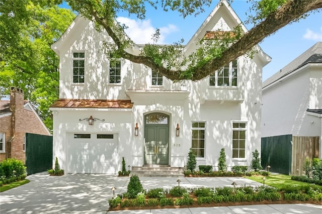 108 Dorrington Blvd, Metairie, LA 70005 - view of front facade with stucco siding, an attached garage, and driveway