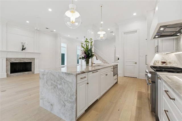 108 Dorrington Blvd, Metairie, LA 70005 - kitchen with extractor fan, stainless steel range, light wood-style floors, white cabinetry, and recessed lighting