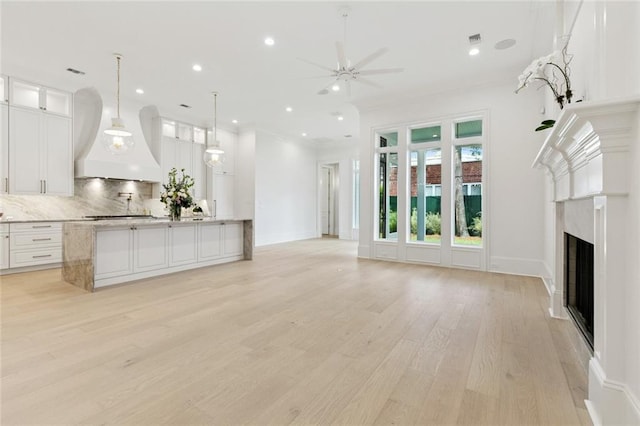 108 Dorrington Blvd, Metairie, LA 70005 - unfurnished living room with ceiling fan, light wood-style floors, a fireplace, and recessed lighting