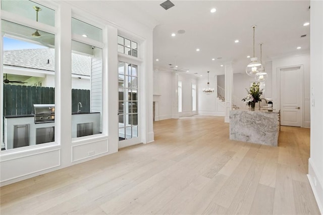 108 Dorrington Blvd, Metairie, LA 70005 - unfurnished living room featuring a ceiling fan, light wood finished floors, a chandelier, and recessed lighting