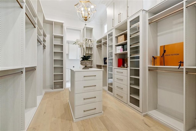 108 Dorrington Blvd, Metairie, LA 70005 - spacious closet with light wood-type flooring and a chandelier