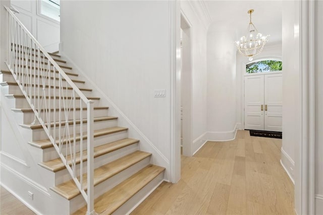 108 Dorrington Blvd, Metairie, LA 70005 - entrance foyer with stairway, light wood-type flooring, and a chandelier