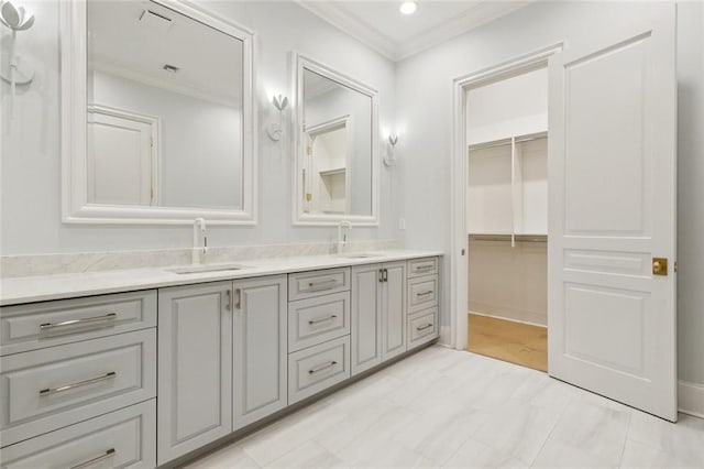 108 Dorrington Blvd, Metairie, LA 70005 - bathroom with double vanity, crown molding, a spacious closet, and recessed lighting