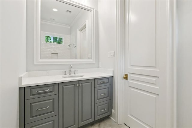 108 Dorrington Blvd, Metairie, LA 70005 - bathroom with ornamental molding, vanity, and marble look tile flooring