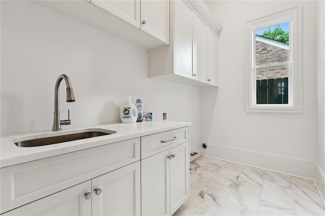 108 Dorrington Blvd, Metairie, LA 70005 - laundry room with cabinet space, light marble finish floors, and hookup for a washing machine