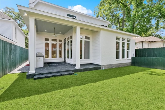 108 Dorrington Blvd, Metairie, LA 70005 - back of house featuring a fenced backyard and a ceiling fan