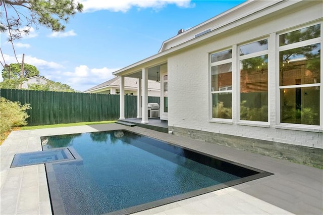 108 Dorrington Blvd, Metairie, LA 70005 - view of pool with a fenced backyard, a patio, a pool with connected hot tub, and grilling area