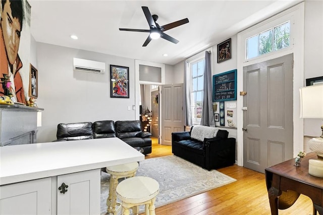 922 Elysian Fields Ave Unit B, New Orleans, LA 70117 - living area featuring an AC wall unit, light wood-type flooring, ceiling fan, and recessed lighting
