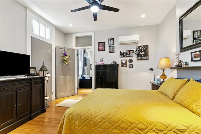922 Elysian Fields Ave Unit B, New Orleans, LA 70117 - bedroom with a wall unit AC, light wood-type flooring, recessed lighting, and ceiling fan