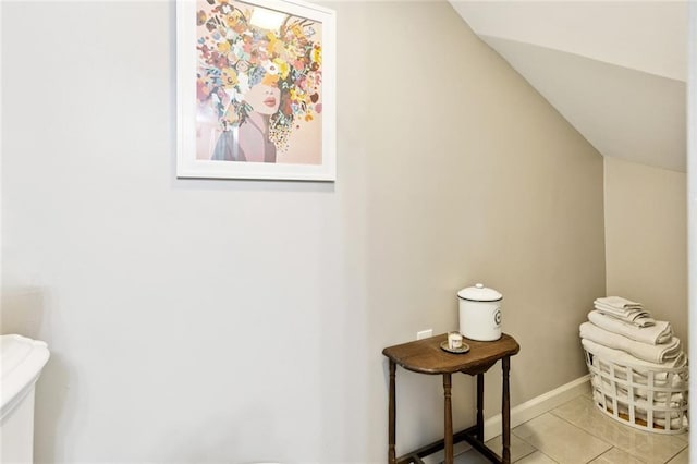 922 Elysian Fields Ave Unit B, New Orleans, LA 70117 - bathroom featuring vaulted ceiling and tile patterned floors