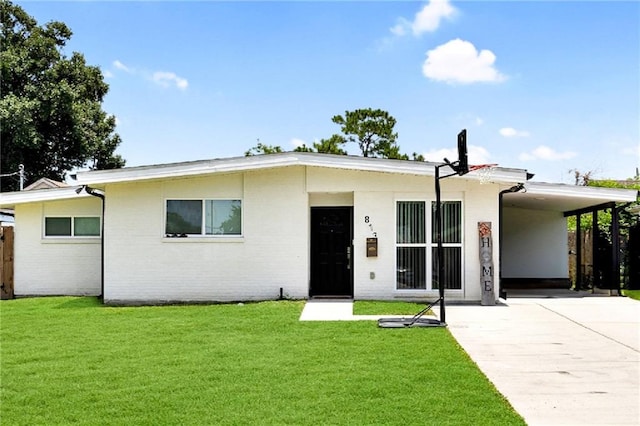 813 Cynthia Ave, Metairie, LA 70003 - view of front of home with an attached carport, concrete driveway, and a front yard