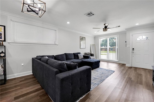 813 Cynthia Ave, Metairie, LA 70003 - living room featuring dark wood-style floors, ornamental molding, a ceiling fan, recessed lighting, and a chandelier