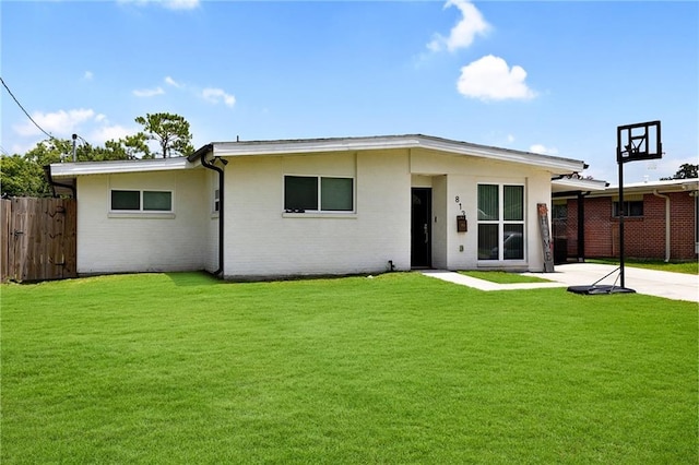 813 Cynthia Ave, Metairie, LA 70003 - back of property featuring a patio, brick siding, and driveway