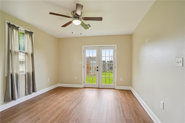 3713 Lausat St, Metairie, LA 70001 - spare room featuring healthy amount of natural light, wood finished floors, french doors, and a ceiling fan