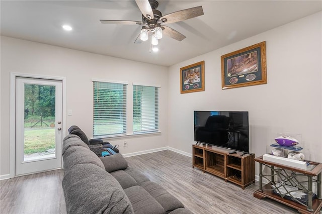 28399 Longfellow Ln, Albany, LA 70711 - living area with wood finished floors, plenty of natural light, ceiling fan, and recessed lighting