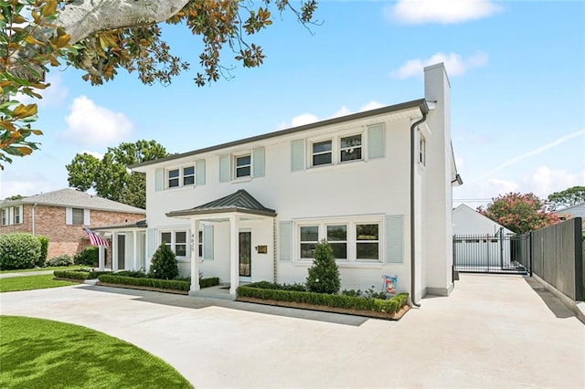 4625 Cleveland Pl, Metairie, LA 70003 - view of front of home with a chimney, a standing seam roof, and stucco siding