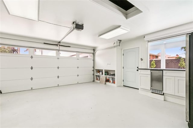 4625 Cleveland Pl, Metairie, LA 70003 - garage featuring fridge and a garage door opener