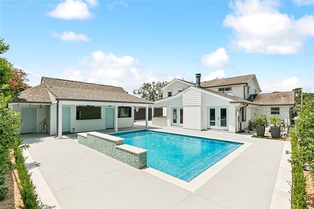 4625 Cleveland Pl, Metairie, LA 70003 - rear view of house featuring french doors, an outdoor pool, a patio, and roof with shingles
