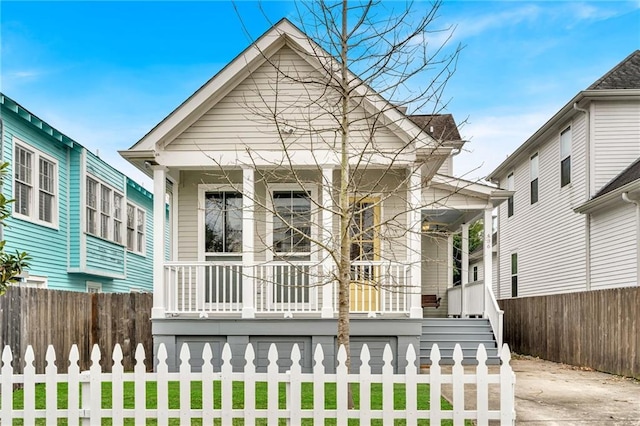 436 S Cortez St, New Orleans, LA 70119 - shotgun-style home with covered porch and a fenced front yard