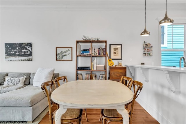 436 S Cortez St, New Orleans, LA 70119 - dining area featuring crown molding and wood finished floors