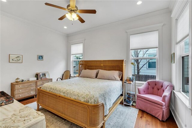 436 S Cortez St, New Orleans, LA 70119 - bedroom with multiple windows, light wood-style flooring, crown molding, recessed lighting, and ceiling fan