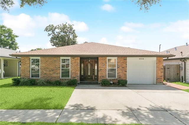 4513 Dreyfous Ave, Metairie, LA 70006 - single story home with a garage, a front lawn, concrete driveway, and brick siding
