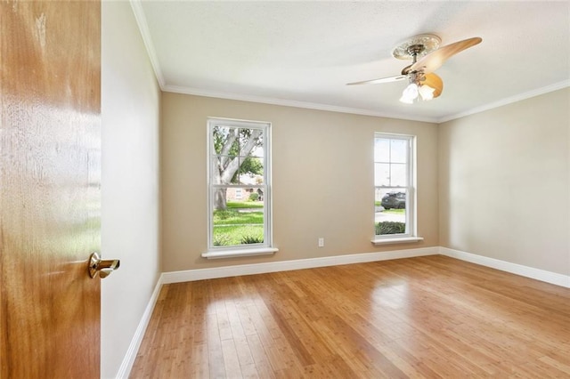 4513 Dreyfous Ave, Metairie, LA 70006 - empty room featuring plenty of natural light, hardwood / wood-style flooring, ornamental molding, and a ceiling fan