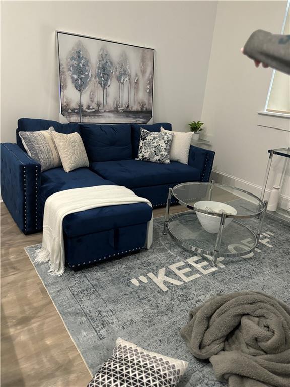 1201 Canal St Unit 216, New Orleans, LA 70112 - living room with wood finished floors