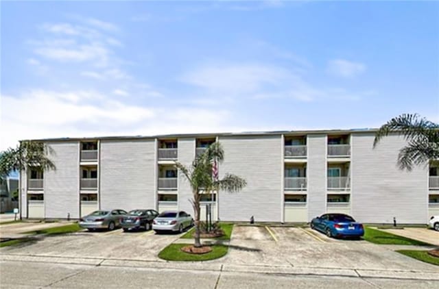 2330 Edenborn Ave Unit 116, Metairie, LA 70001 - view of apartment building / complex featuring uncovered parking