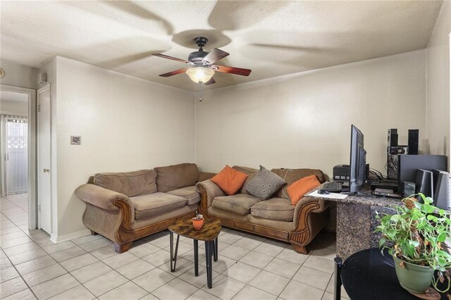 2330 Edenborn Ave Unit 116, Metairie, LA 70001 - living area with a ceiling fan, light tile patterned floors, and a textured ceiling