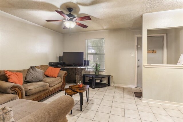 2330 Edenborn Ave Unit 116, Metairie, LA 70001 - living area with ceiling fan, light tile patterned floors, and a textured ceiling