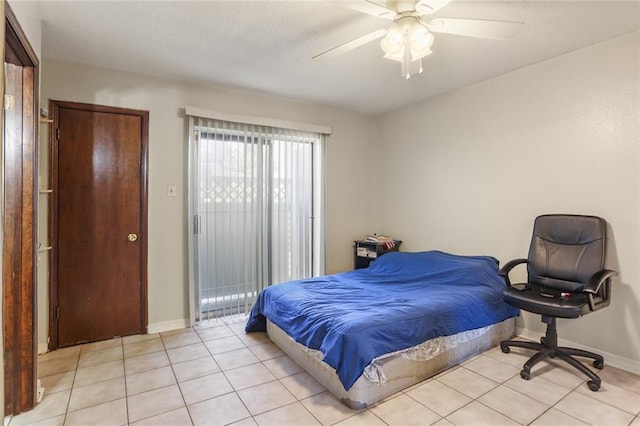 2330 Edenborn Ave Unit 116, Metairie, LA 70001 - bedroom featuring light tile patterned floors, access to outside, and ceiling fan