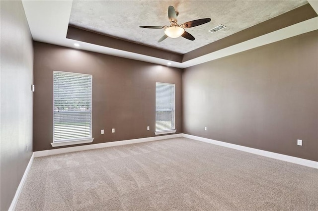314 Spartan Loop, Slidell, LA 70458 - spare room with carpet floors, a tray ceiling, and ceiling fan