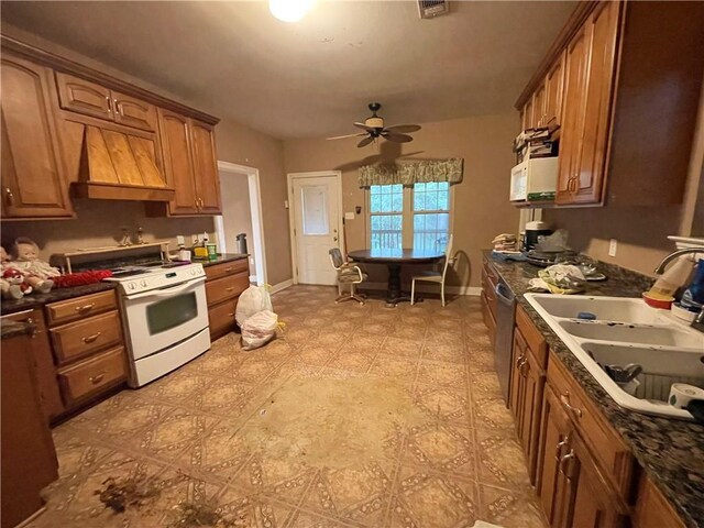 2986 Palm Dr, Slidell, LA 70458 - kitchen featuring white electric range oven, custom exhaust hood, dark countertops, a ceiling fan, and brown cabinetry